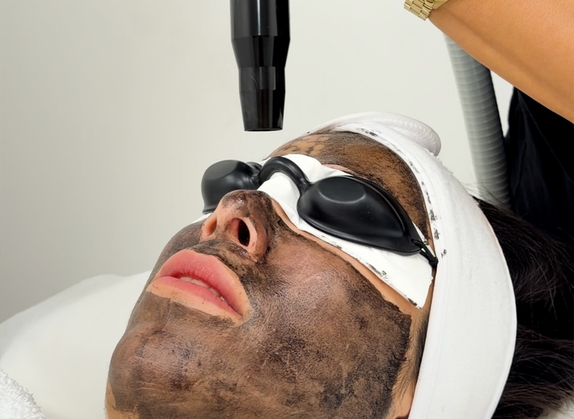 Woman receiving a facial treatment
